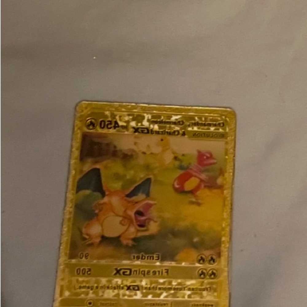 Charizard Pokémon Card with Gold Border